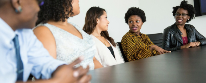 Leader calmly communicating with team during a period of business uncertainty