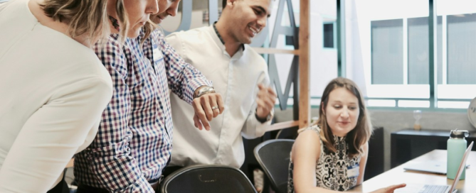 Leader thoughtfully delegating responsibility to a capable team member in the workplace